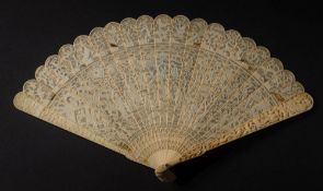 A 19th century Cantonese double side carved ivory brise fan: the pierced leaves with figures in a