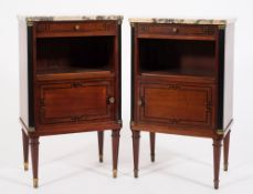 A pair of French mahogany and inlaid bedside cabinets:, decorated with ebonised lines,