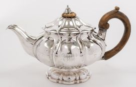 A George IV silver teapot, maker Benjamin Preston, London, 1825: monogrammed and crested,