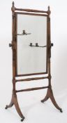 A Regency mahogany swing frame cheval mirror:,