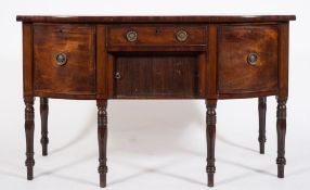 A Regency mahogany and inlaid bow-fronted sideboard:, bordered with ebony lines,