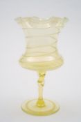 A 'vaseline' glass vase by Harry Powell for Whitefriars: the yellow tinged body of goblet form,