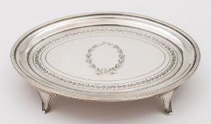 A George III silver tea pot stand, maker Henry Nutting, London, 1800: of oval outline,