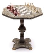 A 19th Century Indian Mysore miniature chess table and chess set: the wooden octagonal table with