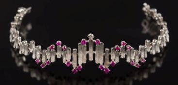 WITHDRAWN LOT A ruby and diamond set bracelet: of textured linking, the clasp stamped '750',