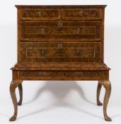 An early 18th Century and later walnut oyster veneer, cross banded and inlaid chest on a stand:,