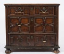A 17th Century oak rectangular chest:, the top with a moulded edge,