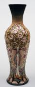 A large Moorcroft pottery trial vase: of slender baluster form tubelined in the Owlpen Manor
