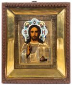 A Russian icon Christ Pantocrator : with painted features enclosed in a gilt metal oklad,