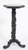 A Chinese carved hardwood hexagonal jardiniere stand:, the top with a gadrooned edge,