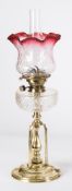 An Arts & Crafts influence brass oil lamp: with Hicks No 2 Lever wick holder,