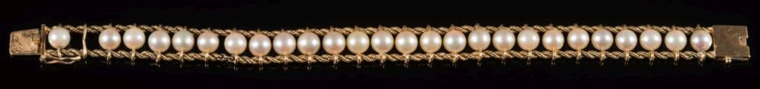 A cultured pearl line bracelet: with 26 cultured pearls,
