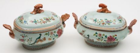 A pair of Chinese famille rose 'double-peacock' pattern tureens and covers: with rococo scroll