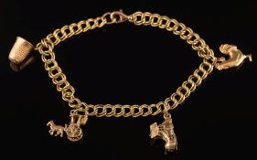 A small 9ct gold charm bracelet: with four various attached charms, 12gms gross weight.