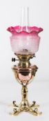 An Arts & Crafts influence brass and copper oil lamp: with Hink's No 2 Duplex wick holder,