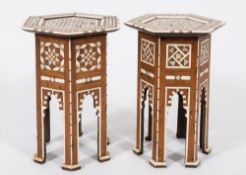 Two similar Near Eastern ivory and mother of pearl inlaid hexagonal occasional tables:,
