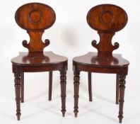 A pair of Regency mahogany hall chairs:,
