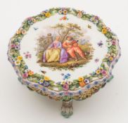 A Meissen porcelain model of a table: of shaped circular form with reticulated frieze,