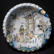 A rare Bristol polychrome delftware bowl: of large size with 'pie-crust' rim,
