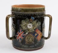A large Doulton Lambeth stoneware Boer War commemorative three-handled loving cup or tyg: inscribed