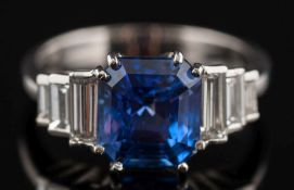 A sapphire and diamond ring: with central octagonal sapphire, 8.3mm long x 7.7mm wide x 6.