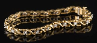 A diamond mounted line bracelet: of pierced design with circular,