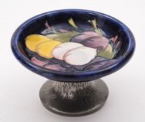 A small Moorcroft and Tudric pewter pedestal bowl: in the Plums pattern, on hammered pewter base,