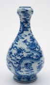 A Chinese porcelain vase: of garlic shaped form painted in blue in the Transitional manner with