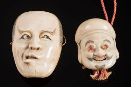A Japanese carved ivory okimono mask of a man: his inset eyes looking left,