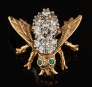 A diamond and emerald-set 'bee' brooch: with circular brilliant-cut diamonds estimated to weigh a