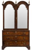 An 18th Century walnut and crossbanded double dome cabinet on chest:, adapted as a wardrobe,
