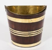 A late 18th century mahogany and brass bound elliptical bucket: with brass and swing handle and