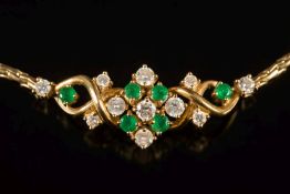 An 18ct gold, emerald and diamond necklace: with cluster of eleven circular,