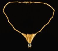 A pear-shaped aquamarine single-stone necklace: the aquamarine approximately 13mm x 9mm in a