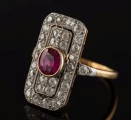 A gold, ruby and diamond mounted rectangular plaque ring: with central oval ruby approximately 1.