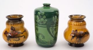 Three George Jones vases: comprising a Pompeian cylinder vase printed with flowers and foliage on a