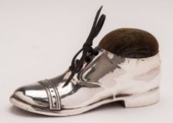 A George V silver novelty pin cushion in the form of a shoe, maker S.