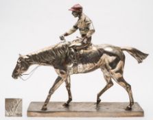After Wilhelm Zwick - a silvered alloy study of a racing stallion with jockey up: wearing cold