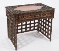 A Chinese carved wood 'Campaign' desk:, the rectangular top with plain centre,