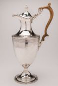 A George III silver wine ewer, maker's mark worn H? , London, 1787: monogrammed,