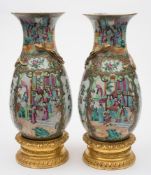 A pair of Canton porcelain vases: each of oviform with flaring neck,