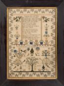 An early 19th century needlework sampler: with poetic verse flanked by flowering shrubs,