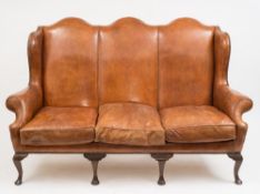 A walnut wing frame triple chair-back settee in the 18th century taste:,