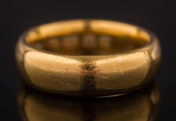 A 22ct gold wedding band:, 9.5gms gross weight, ring size J 1/2.