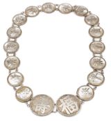 A Chinese silver and mother of pearl belt: the buckle with symbols for long life and good fortune,