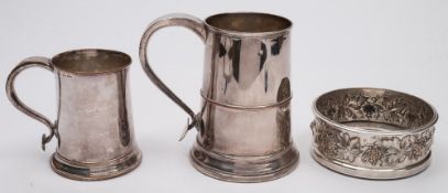 A Georgian Sheffield plate mug: of traditional design of plain cylindrical form with scroll handle