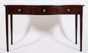 An early 19th Century mahogany serving table:, of serpentine outline,