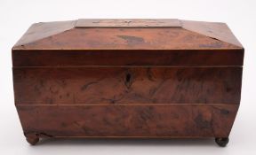 A 19th century yew wood tea caddy: of sarcophagus outline,
