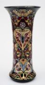 A large Moorcroft pottery vase: of waisted cylindrical form tubelined in the Tapestry of Time