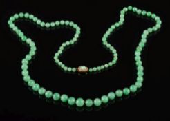 A graduated jade single-string necklace: with 109 beads graduated from 4.7mm to 9.